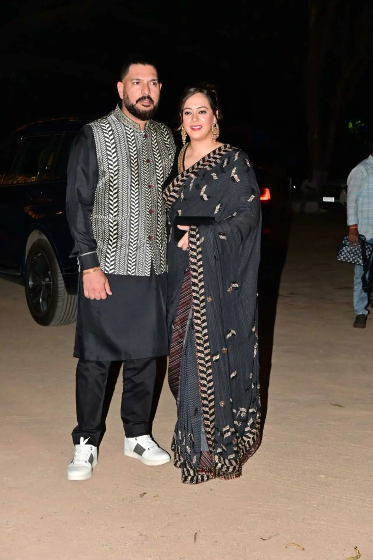 Yuvraj Singh and Hazel Keech arrived in coordinated ethnic looks at the mehendi ceremony. Yuvraj kept it classic in a black kurta layered with a patterned Nehru jacket, while Hazel complemented him in an elegant black saree.